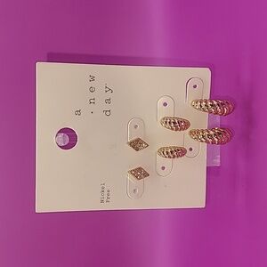 3 pack of gold tone earrings by a new day. NWT